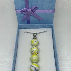 Exquisite Yellow & Silver Swirl Necklace
Expertly Handcrafted, Exclusively Yours